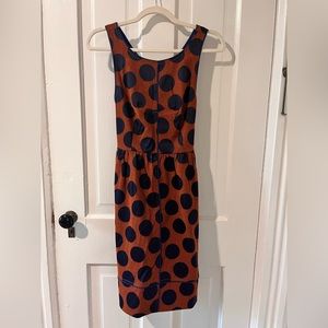 Orange and navy polka dot cocktail dress.